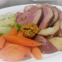 Corned Beef and Cabbage · Slow cooked Corned beef brisket, mashed potatoes, cabbage, carrots, stone ground mustard, Au...