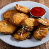 Fried Zucchini · lightly breaded fresh sliced zucchini garnished with grana parmesan and served with a side o...