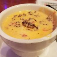 Queso Cheese Dip · Queso Rotel y Carne. Chips with cheese, Rotel, and chargrilled ground beef.  Includes chips.