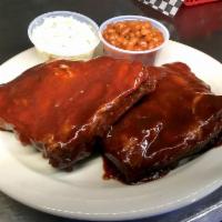 4 Ribs · Served with slaw and baked beans, fries, or tots.
