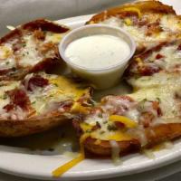Potato Skins #1 Bacon · Served with cheddar, Swiss, and bacon 5.