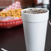 Fountain Drinks · Cup of ice and soda with a straw.