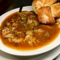 Chicken Gumbo · Chicken and bits of okra smothered in a delicious roux. Served over a mound of rice.