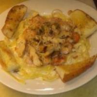 Chicken Alfredo Pasta · Pasta and creamy Alfredo sauce topped with sauteed mushrooms and sprinkled with bacon.