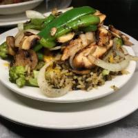 30. Wild Rice · Marinated chicken, mushrooms, Cheddar, broccoli, bell pepper, and sauteed onions.