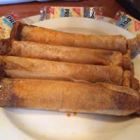 #1 Hot Tamales · 4 wrapped tamales with sour cream.