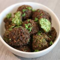 Falafel & Tahini · Best Authentic Falafel (4 pieces), made with chickpeas, fresh herb, and the right spices. Pa...