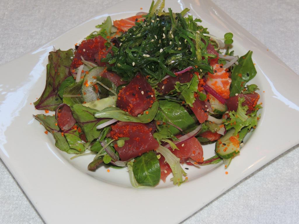 Hawaiian Poki Salad · Chopped tuna or assorted (tuna, salmon, white fish) salad with seaweed, onions, tobiko with spicy sauce.