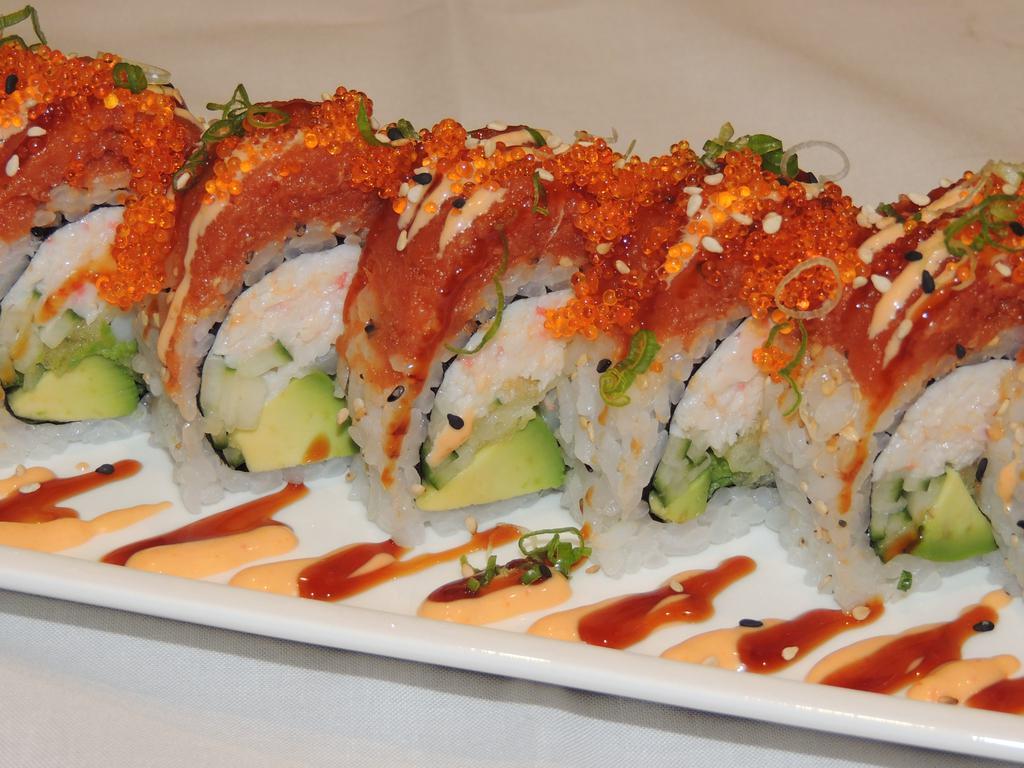 Red Dragon Roll · In: shrimp tempura, avocado, cucumber and crab. Out: spicy tuna, tobiko and scallions.