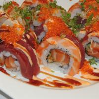 Warrior's Roll · In: spicy salmon and avocado. Out: salmon, tuna, spicy scallops, tobiko and scallions.