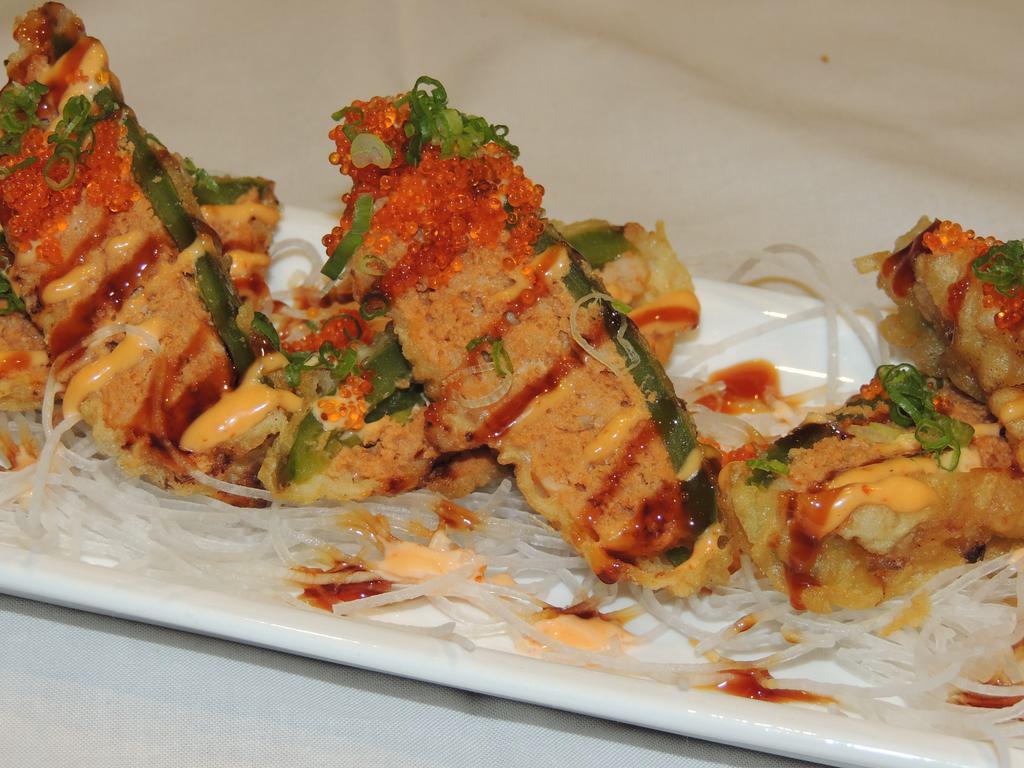 Volcano Roll · No rice. In: jalapeno and spicy tuna. cream cheese Out: deep fried, tobiko and scallions.