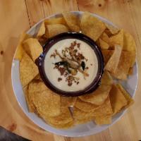 Queso Fundido with Fresh Tortilla Chips · Monchego, Monterey Jack, poblano, and chorizo. 