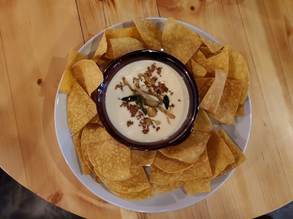 Pint Queso Fundido · Chorizo, rajas served with fresh tortilla chips