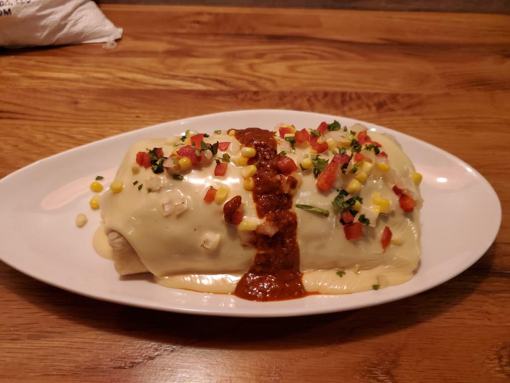 Burrito · Choice of protein, rice, beans, corn salsa, and queso. 