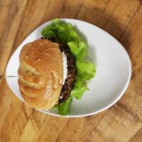 Chipotle and Corn Black Bean Burger · Homemade black bean burger topped with lettuce, tomato, and lime aioli. Served with yucca fr...