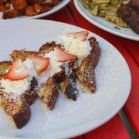 Tres Leches French Toast · Strawberries, orange scented whip cream