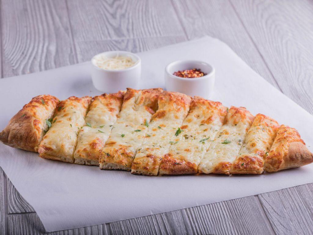 Oggi's Stix · Our pizza dough brushed with garlic olive oil sauce, topped with parsley, mozzarella and Parmesan cheeses. Served with our ranch and marinara sauces.