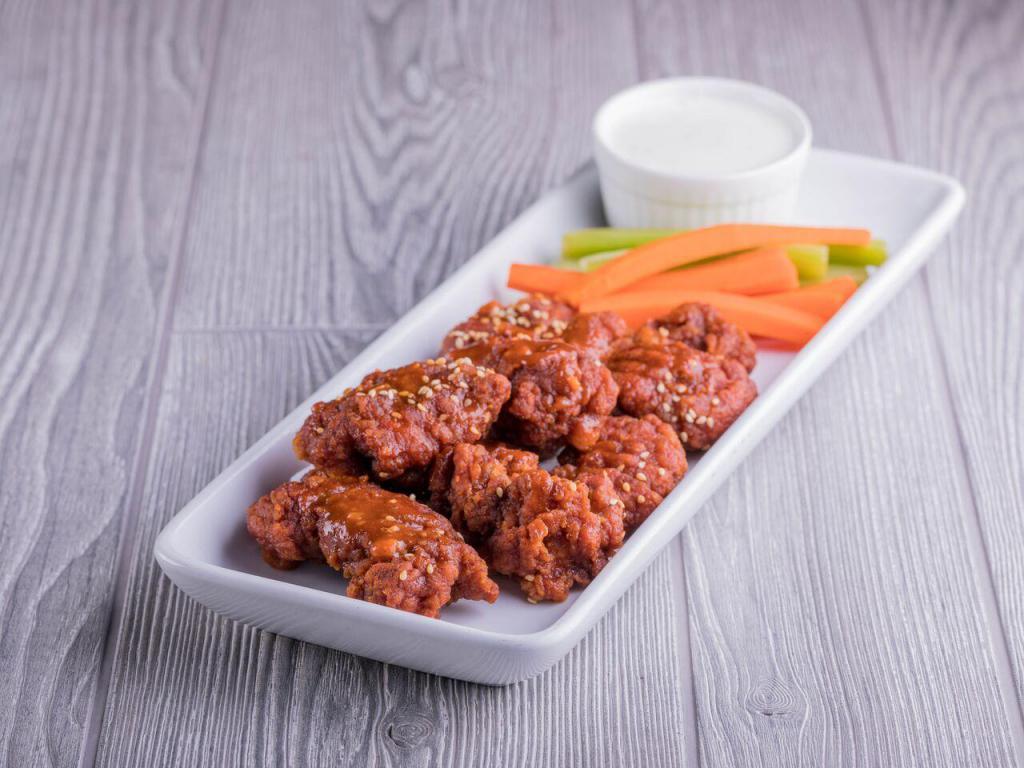 Boneless Wings · All white meat boneless wings tossed in 1 of our signature sauces, sprinkled with toasted sesame seeds and served with carrots, celery and a side of our ranch dip.