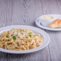 Chicken Alfredo · Classic Alfredo sauce with a blend of garlic, cream and cheeses served over fettuccine toppe...