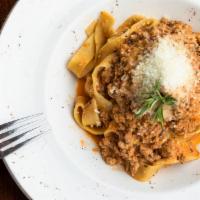 Tagliatelle Bolognese · House-made tagliatelle pasta in a sausage, veal, tomato and onion sauce.