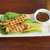 4 Chicken Satay · Curry and coconut milk marinated skewers. Served with peanut sauce.