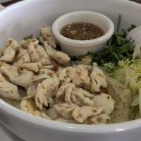 Ginger Chicken Bowl · Chicken with ginger and garlic marinated rice. Served with cilantro, ginger sauce and cucumb...