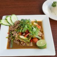Thai Pepper Steak · Stir fried beef, green and red bell peppers, onions, celery, green onion and tomato. Served ...
