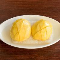 Mango Sticky Rice · Freshly cut mango over a bed of sticky rice and drenched in sweet coconut cream
