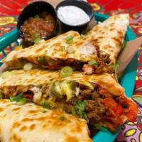 Brisket Quesadilla  · Cooked tortilla that is filled with cheese and folded in half. 