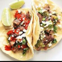 17. Tacos al Carbon Lunch Special · 2 tacos, chicken or beef, served with vegetables.