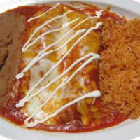 Enchiladas Combo · 2 enchiladas with rice and beans covered in red or green sauce with sour cream on top.