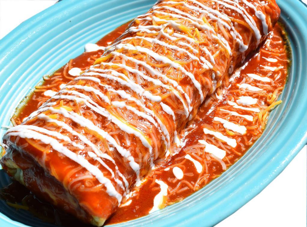 Gordo's Chimichanga · Comes with choice of meat and stuffed with rice and beans. Pictured enchilada style.