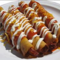 Rolled Taquitos · 4 rolled tacos with choice of meat, pictured enchilada style.