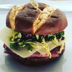 Pastrami Sandwich · Pastrami with wasabi mustard, Asian kale slaw, Swiss cheese on a pretzel roll.