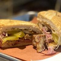 Cuban Sandwich · Tender roasted pulled pork, Black Forest ham, Swiss cheese, pickle dill and stone ground mus...