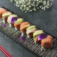 Nassau Roll · Spicy crunch tuna roll topped with shrimp, salmon and avocado. 