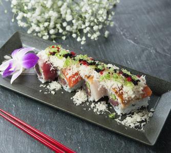 Angel Roll · Blackened tuna, asparagus, inside, topped with tuna, salmon, yellowtail, eel, wasabi and mango eel sauce. 
