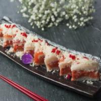 Foxy Lady Roll · Squares of pressed rice layered with tuna, spicy tuna and yellowtail, salmon topped with spi...