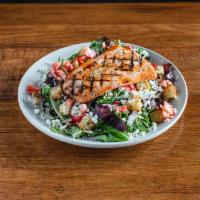 Salade de Saumon Grille · Grilled salmon with spring mix, caramelized pecans, feta cheese, tomatoes, strawberries & cr...