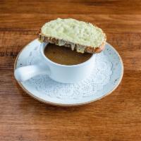 Soupe a Loignon · French onion soup served with a Gruyere toast.