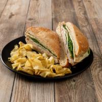 Turkey Dijon Sandwich · Turkey, spinach, Swiss cheese, and Dijon mustard. All sandwiches are served with potato chips.