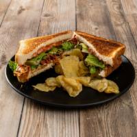BLT Sandwich · Bacon, lettuce and tomatoes and mayo 
All sandwiches are served with potato chips.
