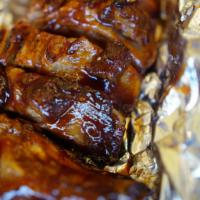 1/4 Baby Back Ribs Meal · Served with one side order, pita bread, and sauce.