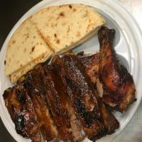 1/2 Chicken and 1/2 Baby Ribs · Served with pita bread and BBQ sauce.