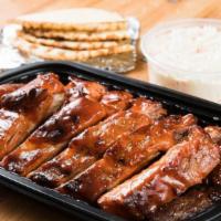 Whole Rack Baby Back Ribs · Served with pita bread and BBQ sauce.