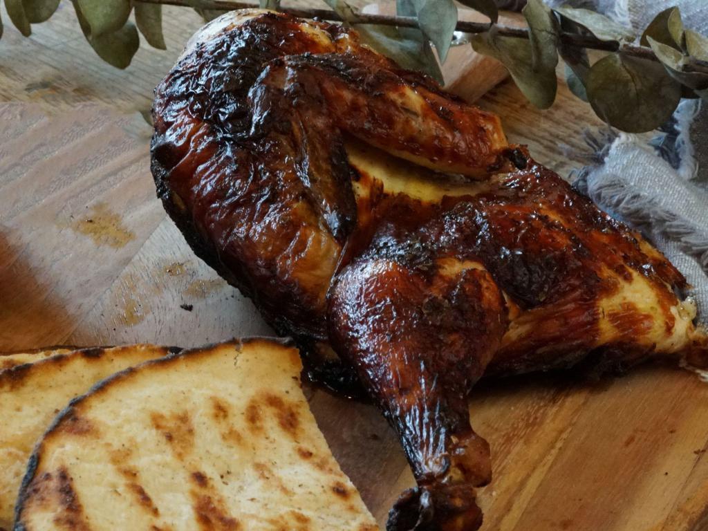 Charcoal Broiled 1/2 Chicken · Served with pita bread and sauce.