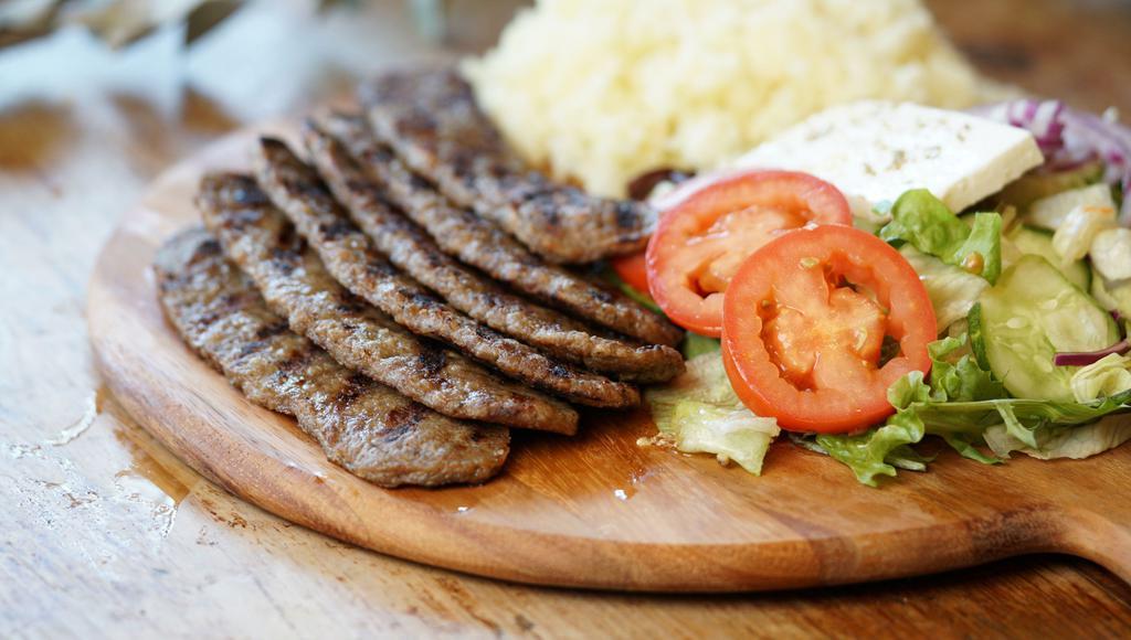 Lamb Gyro Platter · Served with salad, pita bread and tzatziki sauce and choice of side.