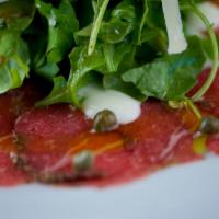 Carpaccio di Filettuccio · Tenderloin sliced and seasoned with peppers and fennel seeds, arugula, Parmesan cheese, baby...