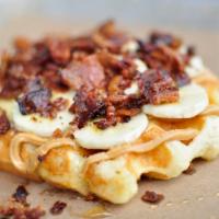 The Elvis Waffle · Fresh sliced bananas, bacon crumble, peanut butter, and honey on our golden Liege waffle.
