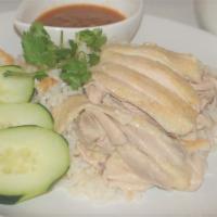 Khao Man Gai Tom · Boiled Chicken and Rice Served with cucumber, cilantro and Khao Man Gai sauce.